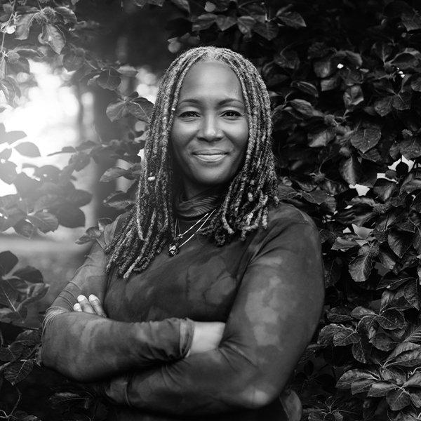 Black Woman in feild headshot of Angela Jackson FieldWise Marketing Group