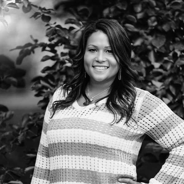 Photo of a black woman in the park, headshot. FieldWise Marketing Group